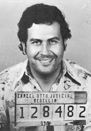Pablo Escobar's iconic 1977 smiling mugshot taken by Colombian authorities after his cocaine paste arrest